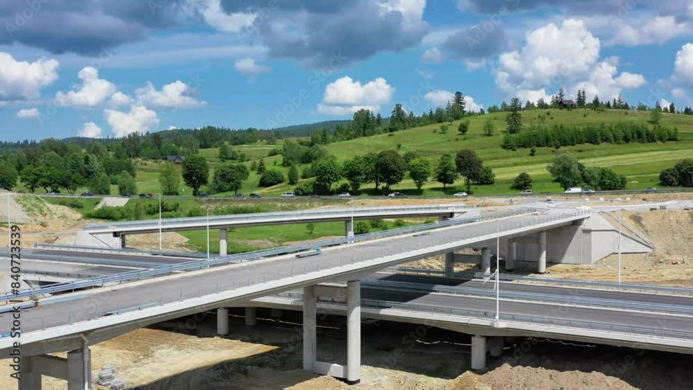 Drone shot of the highway construction from Krakow to Zakopane in the summer. The road will lead into the Polish Tatra Mountains. Drone shot of the highway construction from Krakow to Zakopane in the summer. The road will lead into the Polish Tatra Mountains.