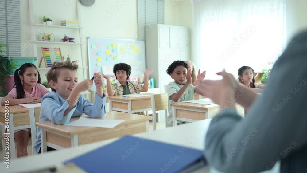 Teacher and students, Learn and study in a classroom of school where youngsters sit and listen attentively. Teacher and students, Learn and study in a classroom of school where youngsters sit and listen attentively.
