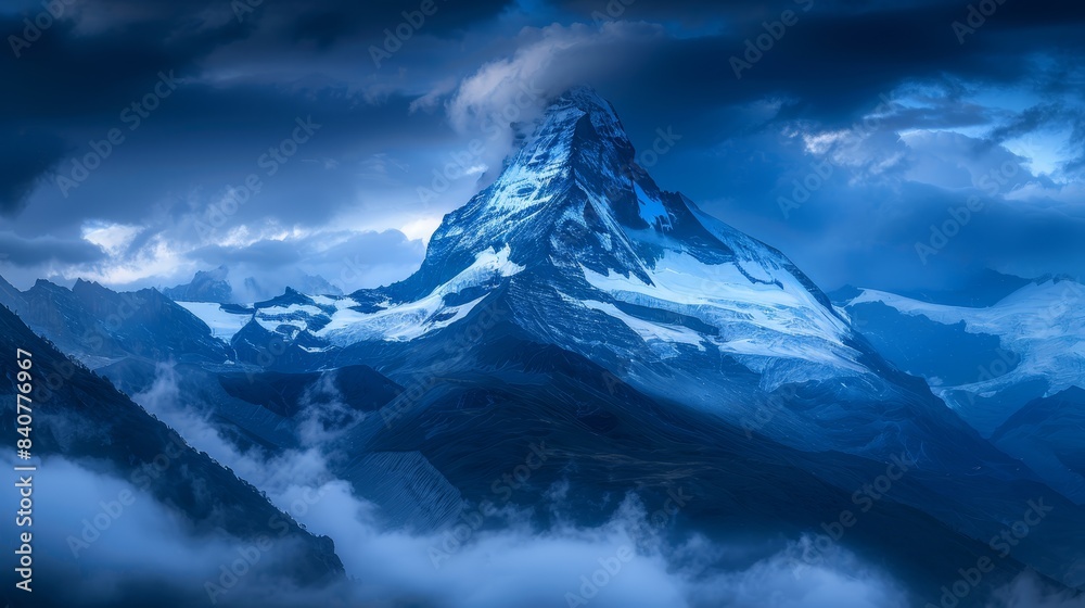 A towering mountain, enveloped by clouds beneath a vast blue sky, bears a few clouds in its foreground The peak of the mountain also features a few clouds A towering mountain, enveloped by clouds beneath a vast blue sky, bears a few clouds in its foreground The peak of the mountain also features a few clouds