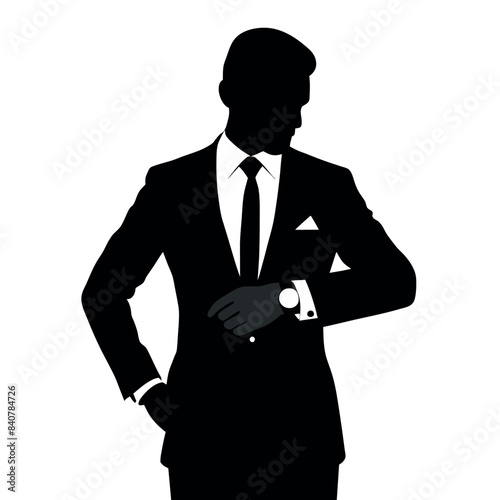 business man in a suit standing and checking time on the wristwatch in a vector silhouette 