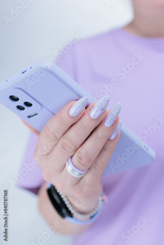 Woman's hands holding a large smartphone