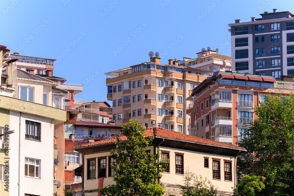 Cityscape, view of buildings and houses with green plants in public places in Turkey, sunny summer day in the city of Istanbul Cityscape, view of buildings and houses with green plants in public places in Turkey, sunny summer day in the city of Istanbul