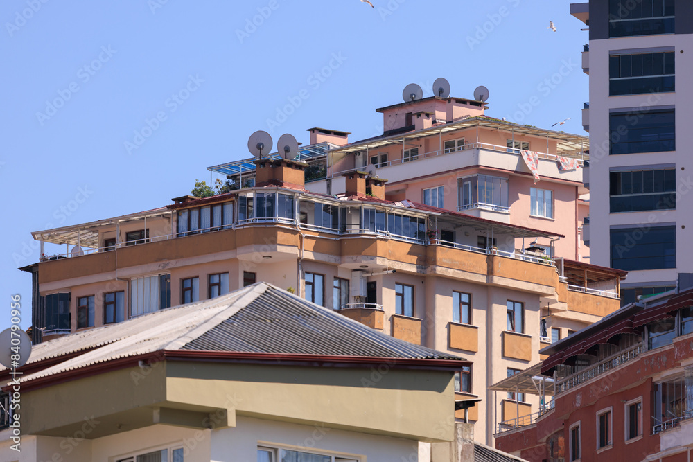 Cityscape, view of buildings and houses with green plants in public places in Turkey, sunny summer day in the city of Istanbul Cityscape, view of buildings and houses with green plants in public places in Turkey, sunny summer day in the city of Istanbul