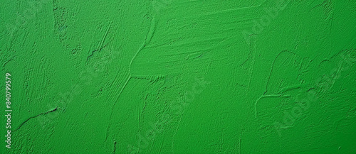 Vibrant green painted wall with a textured background, ideal for modern designs. Adds a touch of grunge and a fresh feel, perfect for promotions or adding color to websites and social media