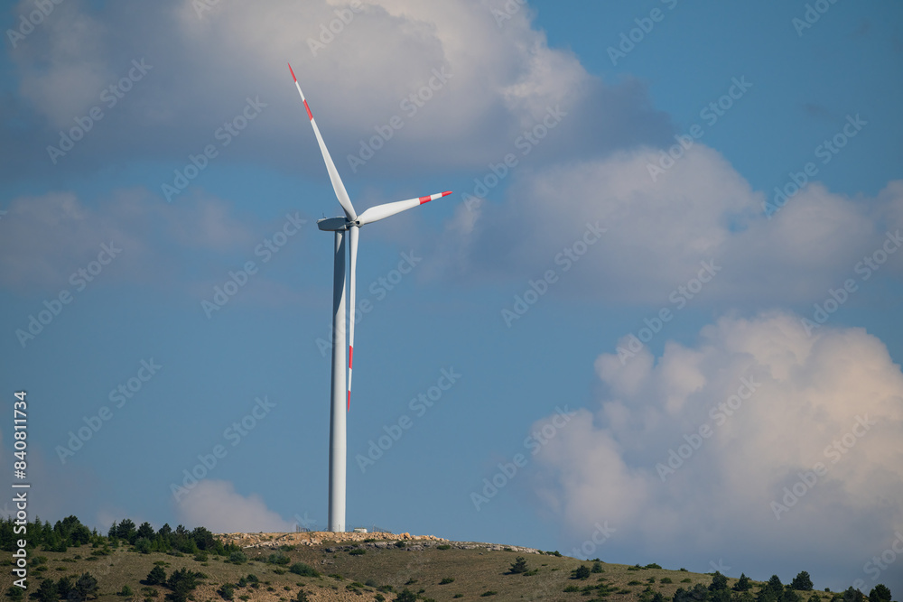 Wind turbines against the blue and cloud sky. Wind turbines against the blue and cloud sky.