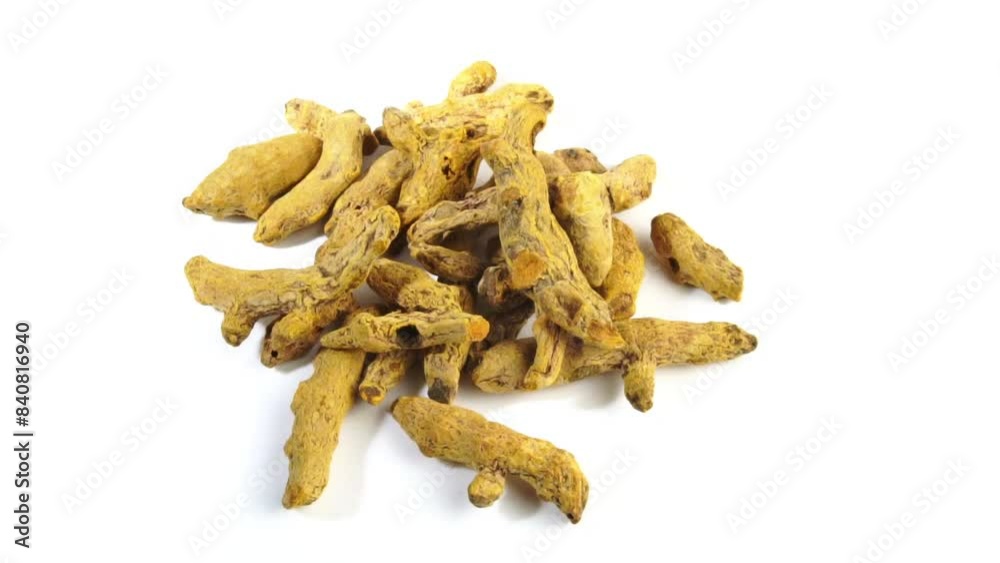 Dry Turmeric rotating on white Dry Turmeric rotating on white