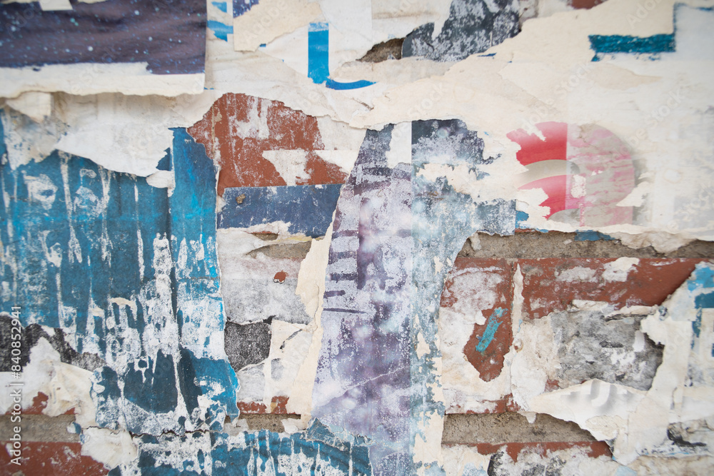 Fototapeta premium Torn and weathered street poster background, abstract paper collage backdrop