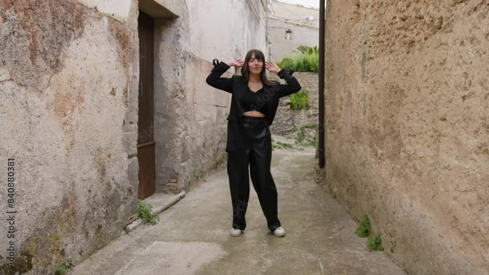 Woman Dressed In Black Dances Through the Alleys Of The Village Woman Dressed In Black Dances Through the Alleys Of The Village