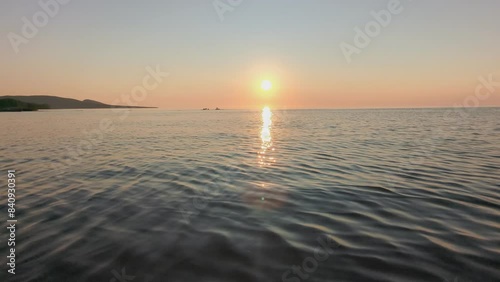 Sunset over Lake Superior in Michigan with the Porcupine Mountains in the background photo