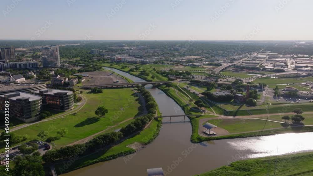 Trinity River in Fort Worth, Texas, from an aerial point of view. Urban landscape, green spaces, and modern architecture in a bright day Trinity River in Fort Worth, Texas, from an aerial point of view. Urban landscape, green spaces, and modern architecture in a bright day