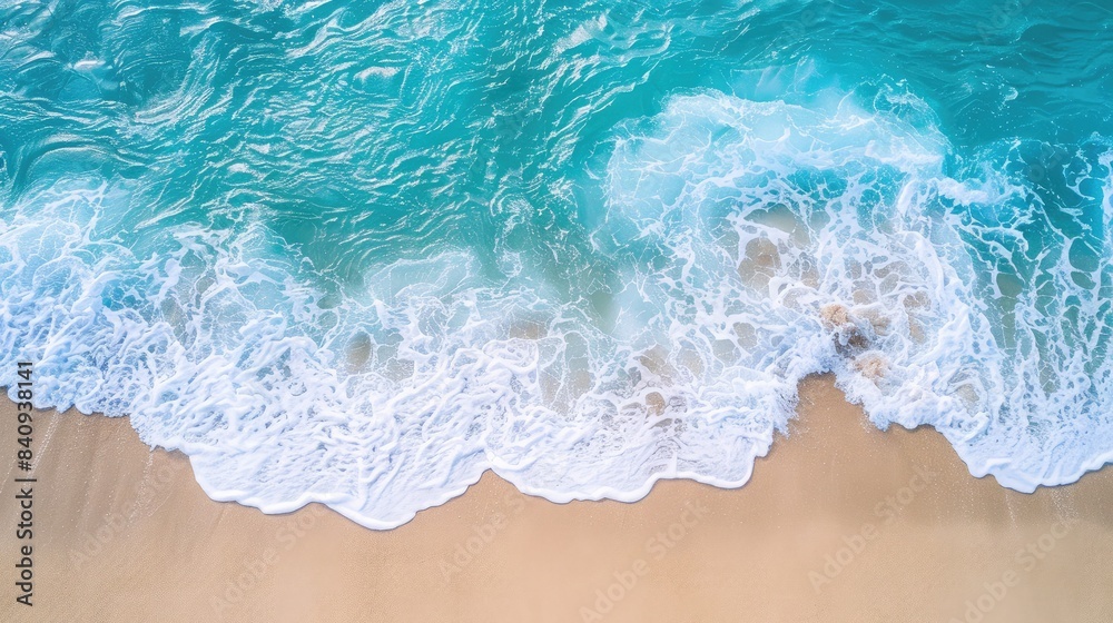 Aerial view of a pristine beach with turquoise waves gently lapping against the shore Aerial view of a pristine beach with turquoise waves gently lapping against the shore