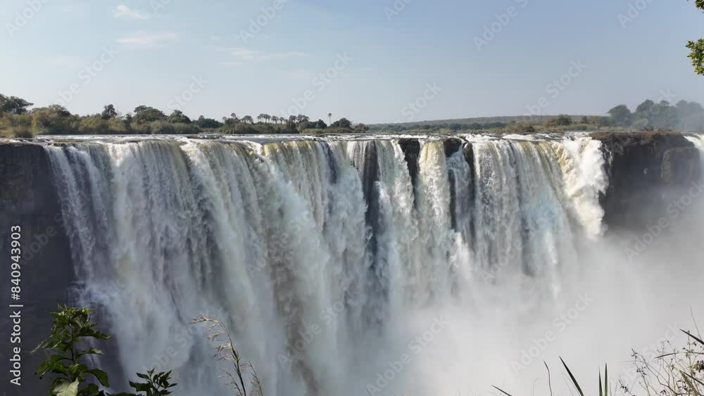 Victoria Falls At Livingstone In Northern Rhodesia Zambia. Giant Waterfalls. Nature Landscape. Livingstone At Northern Rhodesia Zambia. Zambezi River. Travel Scenery. Victoria Falls At Livingstone In Northern Rhodesia Zambia. Giant Waterfalls. Nature Landscape. Livingstone At Northern Rhodesia Zambia. Zambezi River. Travel Scenery.