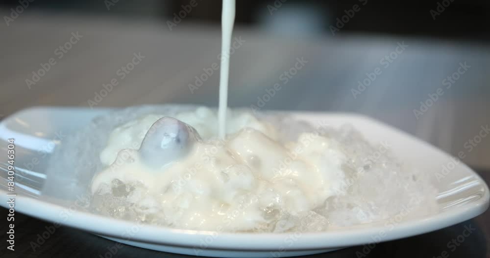 Close up of twist white cream spining add more flour and mixing color in the blow. Prepare yogurt with ice Close up of twist white cream spining add more flour and mixing color in the blow. Prepare yogurt with ice