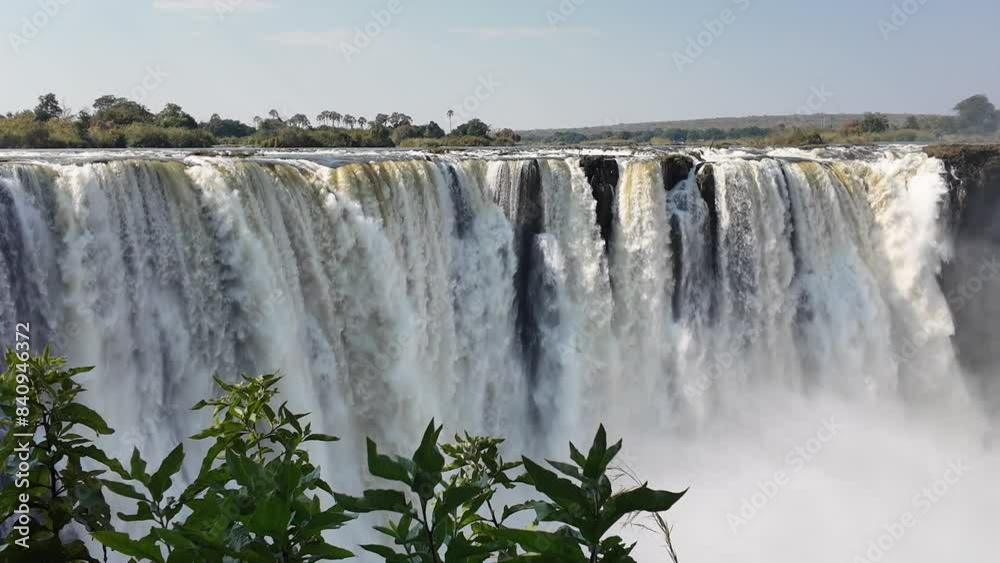 Wild Water Falls At Victoria Falls In Matabeleland North Zimbabwe. Giant Waterfalls. Nature Landscape. Victoria Falls At Matabeleland North Zimbabwe. Zambezi River. Travel Scenery. Wild Water Falls At Victoria Falls In Matabeleland North Zimbabwe. Giant Waterfalls. Nature Landscape. Victoria Falls At Matabeleland North Zimbabwe. Zambezi River. Travel Scenery.