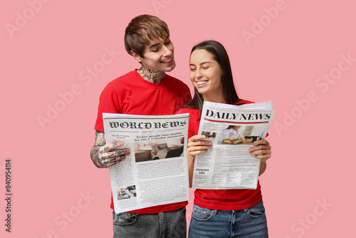 Young couple with newspaper...