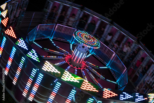 fun carnival ride in action at night photo