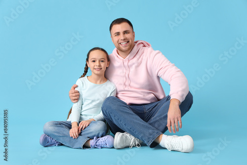 Father and his daughter sit...