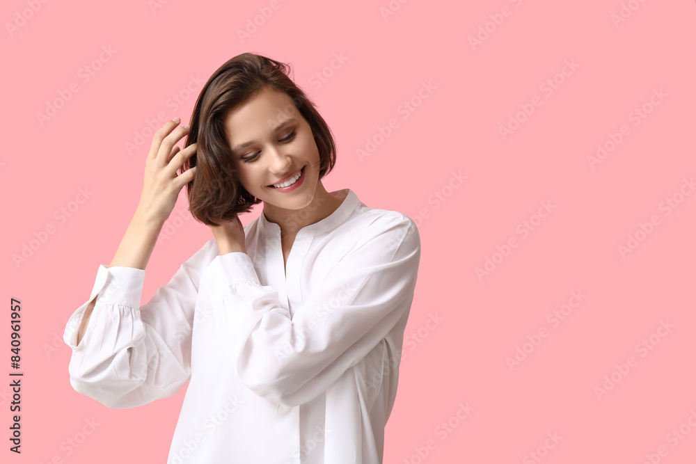 Beautiful young happy woman with bob hairstyle on pink background Beautiful young happy woman with bob hairstyle on pink background