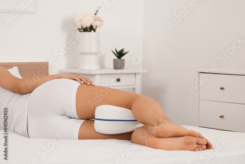 Young woman in pajamas with...