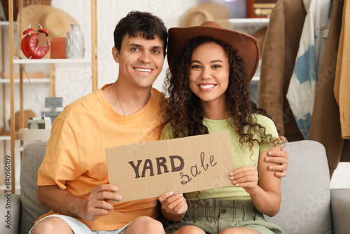 Young couple holding cardbo...