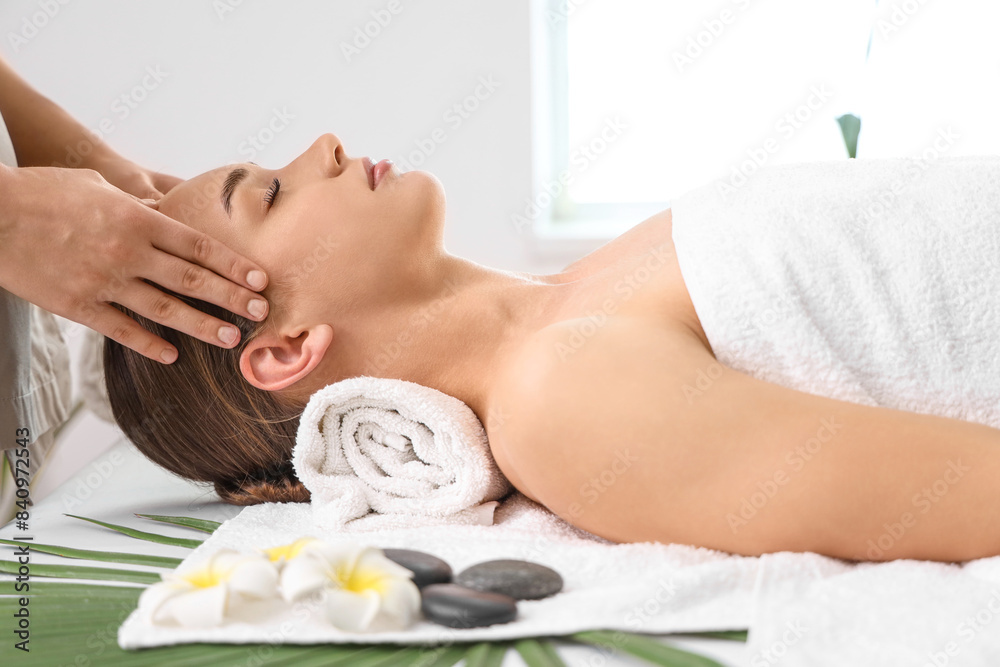 Young woman getting head massage in spa salon, closeup Young woman getting head massage in spa salon, closeup