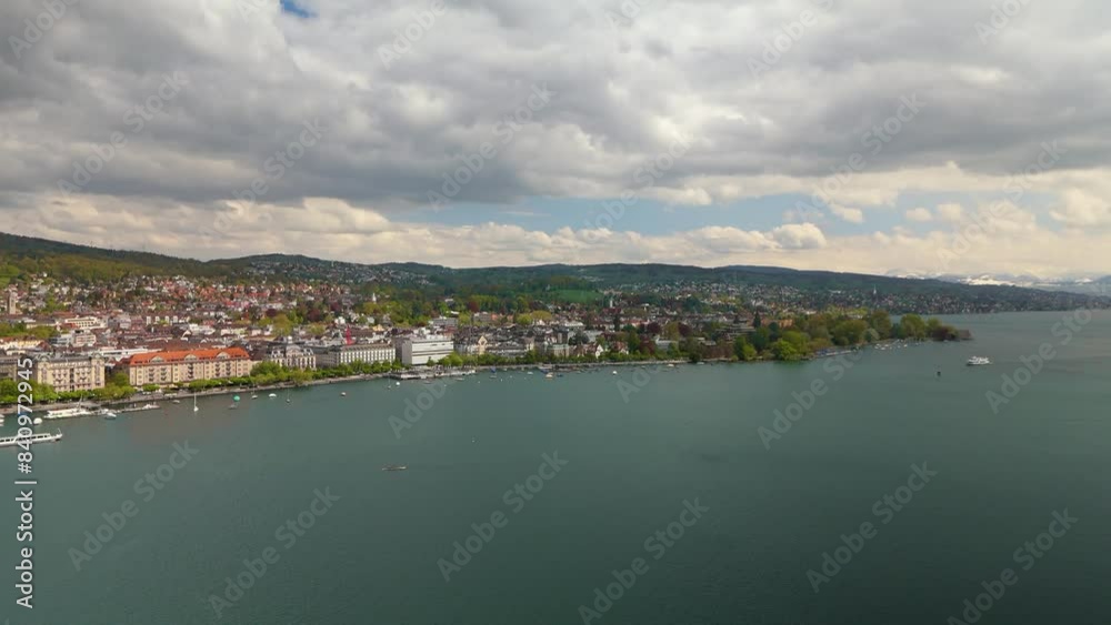 Lake Zurich Switzerland drone aerial backwards town reveal sunny day Lake Zurich Switzerland drone aerial backwards town reveal sunny day