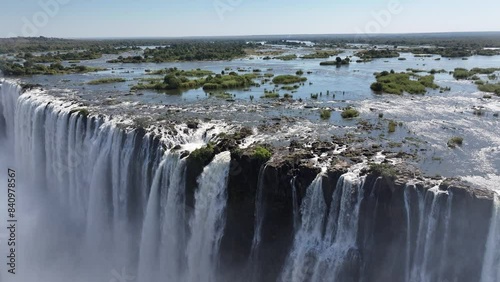 Wild Water Falls At Victoria Falls In Matabeleland North Zimbabwe. Giant Waterfalls. Nature Landscape. Victoria Falls At Matabeleland North Zimbabwe. Zambezi River. Travel Scenery. photo