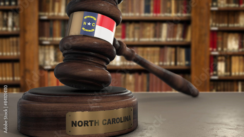 North Carolina Flag on Judge Gavel or Hammer in Court with State Name. Legal System 3D Illustration