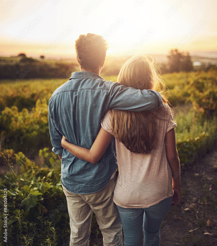 Back, hug and couple in morning, outdoor and together with care, field and date for anniversary in love. Sunrise, partner and person with embrace, nature and peace in grass and relax in Texas in farm Back, hug and couple in morning, outdoor and together with care, field and date for anniversary in love. Sunrise, partner and person with embrace, nature and peace in grass and relax in Texas in farm