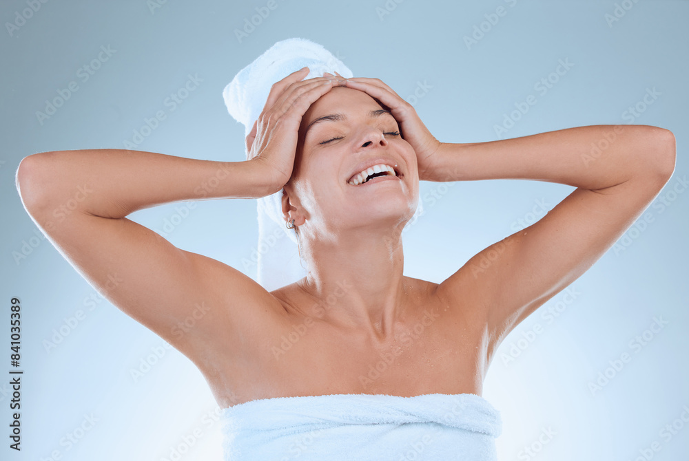 Happy, woman and cosmetics in studio blue background with towel for hygiene, haircare and self care. Female person, clean and smile isolated against backdrop for dermatology and beauty treatment Happy, woman and cosmetics in studio blue background with towel for hygiene, haircare and self care. Female person, clean and smile isolated against backdrop for dermatology and beauty treatment
