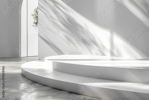 White platform with a curved, minimalist background and soft shadows