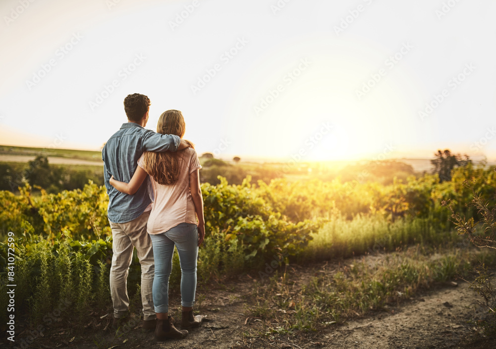 Back, hug and couple in sunrise, field and together with care, love and date for anniversary in outdoor. Morning, partner and person with embrace, nature and peace in grass and relax in Texas in farm Back, hug and couple in sunrise, field and together with care, love and date for anniversary in outdoor. Morning, partner and person with embrace, nature and peace in grass and relax in Texas in farm