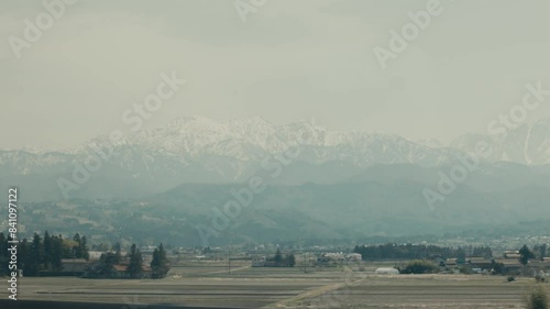Snow-covered Mountain Tateyama In Fog Seen From Toyama Prefecture In Japan. POV, wide shot photo
