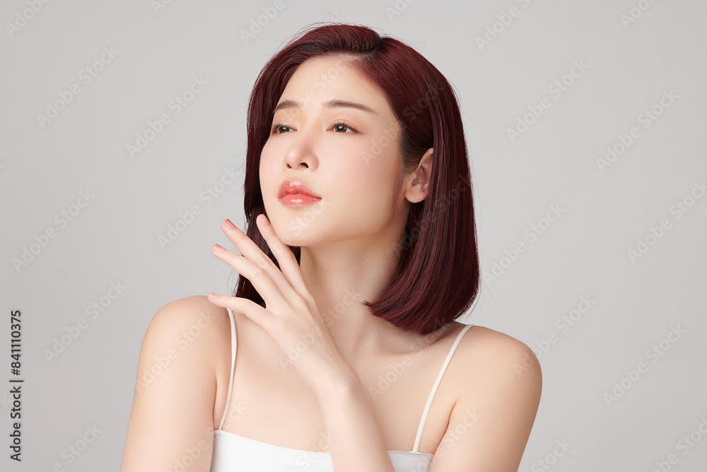 Beautiful young asian woman with clean fresh skin on grey background, Face care, Facial treatment, Cosmetology, beauty and spa, Asian women portrait. Beautiful young asian woman with clean fresh skin on grey background, Face care, Facial treatment, Cosmetology, beauty and spa, Asian women portrait.