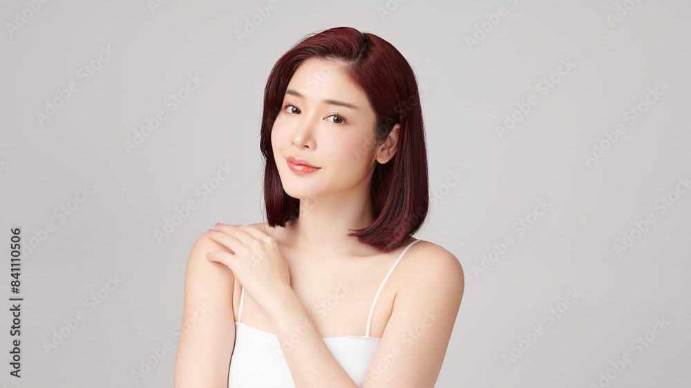 Beautiful young asian woman with clean fresh skin on grey background, Face care, Facial treatment, Cosmetology, beauty and spa, Asian women portrait.