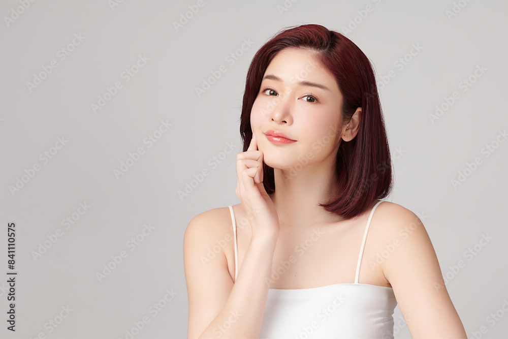 Beautiful young asian woman with clean fresh skin on grey background, Face care, Facial treatment, Cosmetology, beauty and spa, Asian women portrait. Beautiful young asian woman with clean fresh skin on grey background, Face care, Facial treatment, Cosmetology, beauty and spa, Asian women portrait.