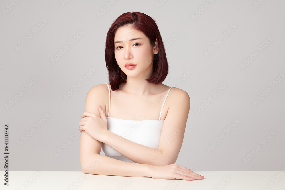 Beautiful young asian woman with clean fresh skin on grey background, Face care, Facial treatment, Cosmetology, beauty and spa, Asian women portrait. Beautiful young asian woman with clean fresh skin on grey background, Face care, Facial treatment, Cosmetology, beauty and spa, Asian women portrait.
