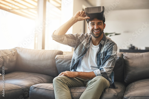 Portriat, man and virtual reality headset in home lounge of cyber experience, metaverse system or gaming connection. Happy gamer, VR or games in living room with future, innovation and ui technology