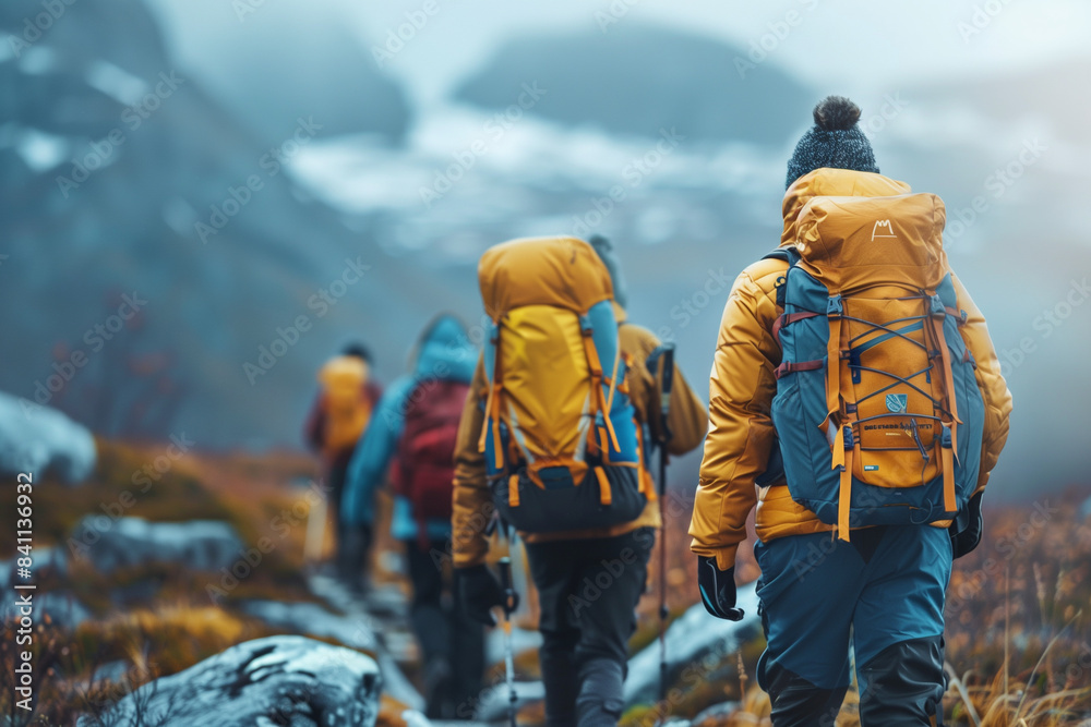 Naklejka premium Hikers trekking through mountain trail