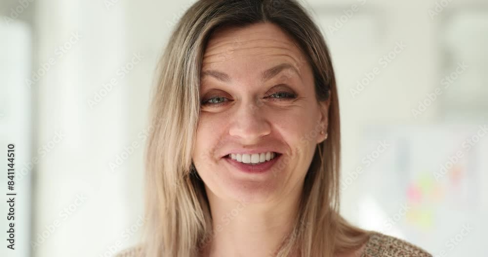 Beautiful woman makes funny face and makes an exaggerated grimace with lips Beautiful woman makes funny face and makes an exaggerated grimace with lips