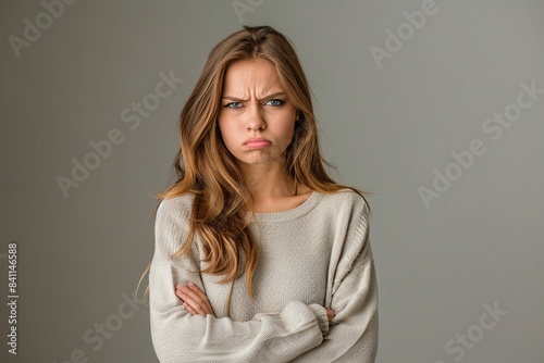 Sad, displeased, offended young woman expressing emotion