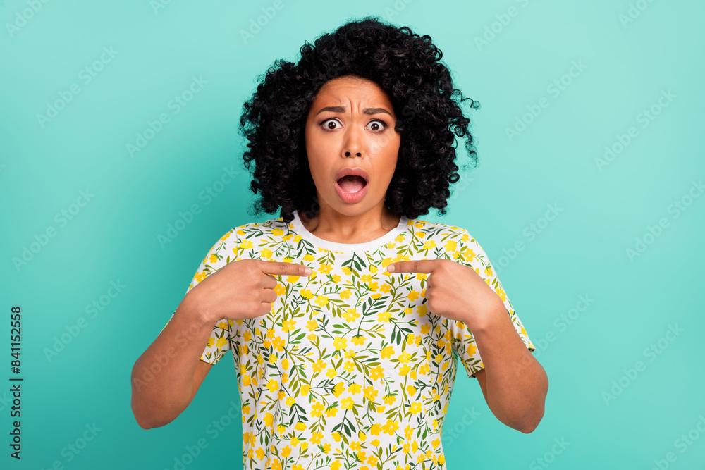 Portrait of nice young girl point fingers self wear t-shirt isolated on turquoise color background Portrait of nice young girl point fingers self wear t-shirt isolated on turquoise color background