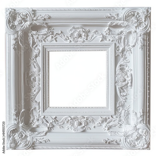 A white picture frame with intricate ornate details sits on a plain white background photo