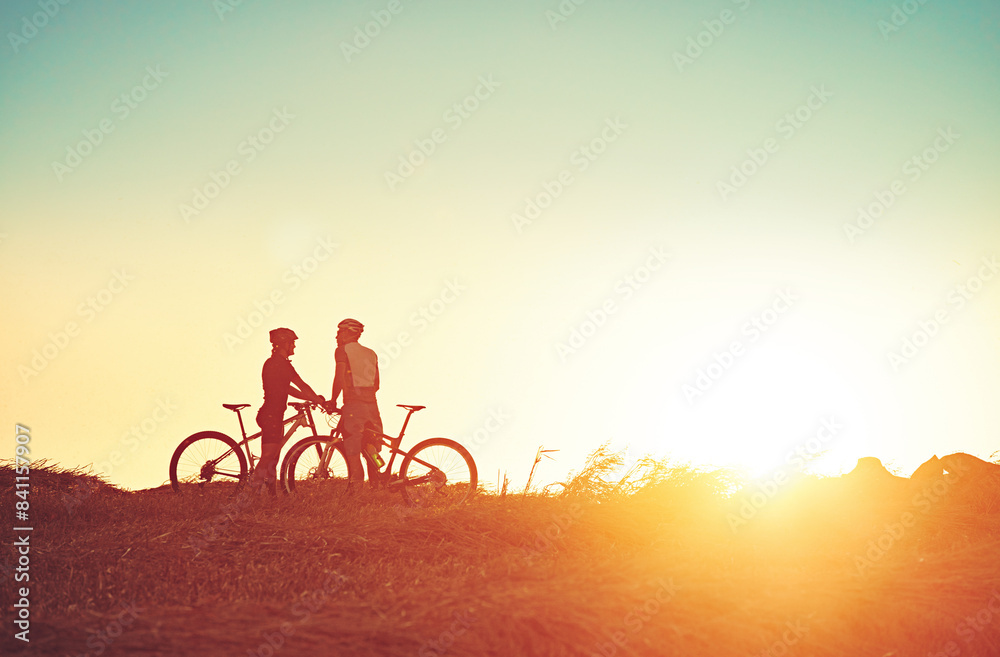 Fitness, sunrise and people with bicycle in morning for training, workout and exercise in countryside. Sports, cycling and friends on mountain bike for adventure, travel and transport in nature Fitness, sunrise and people with bicycle in morning for training, workout and exercise in countryside. Sports, cycling and friends on mountain bike for adventure, travel and transport in nature