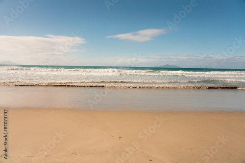 Fototapeta Naklejka Na Ścianę i Meble -  Majestic Waves Crashing on Pristine Beach
