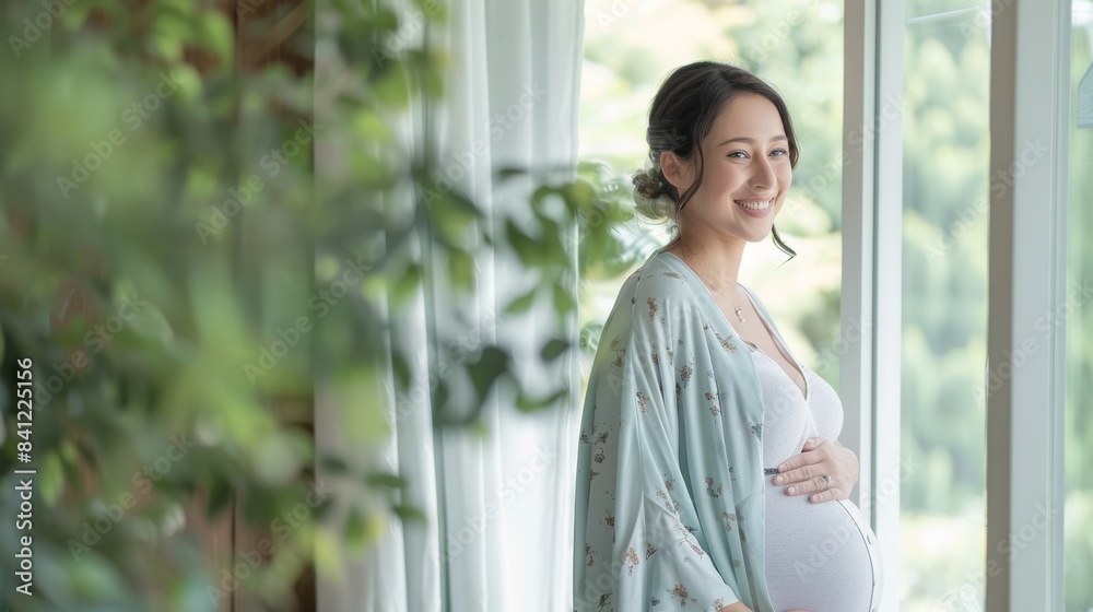 The pregnant woman smiling The pregnant woman smiling