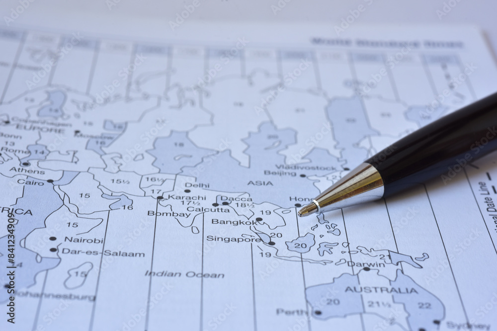 Black shiny premiuvLuxury black pen pointing to world map. Macro photo shot, shallow depth of field Black shiny premiuvLuxury black pen pointing to world map. Macro photo shot, shallow depth of field