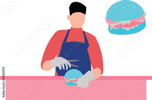 The boy is cutting a burger.