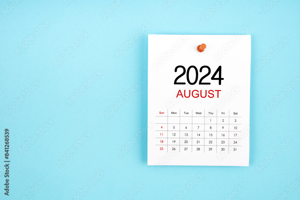 August 2024 calendar page with push pin on blue background. August 2024 calendar page with push pin on blue background.
