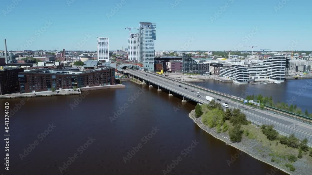 Vehicle traffic on sunny Kulosaari Bridge, aerial over Helsinki FIN Vehicle traffic on sunny Kulosaari Bridge, aerial over Helsinki FIN